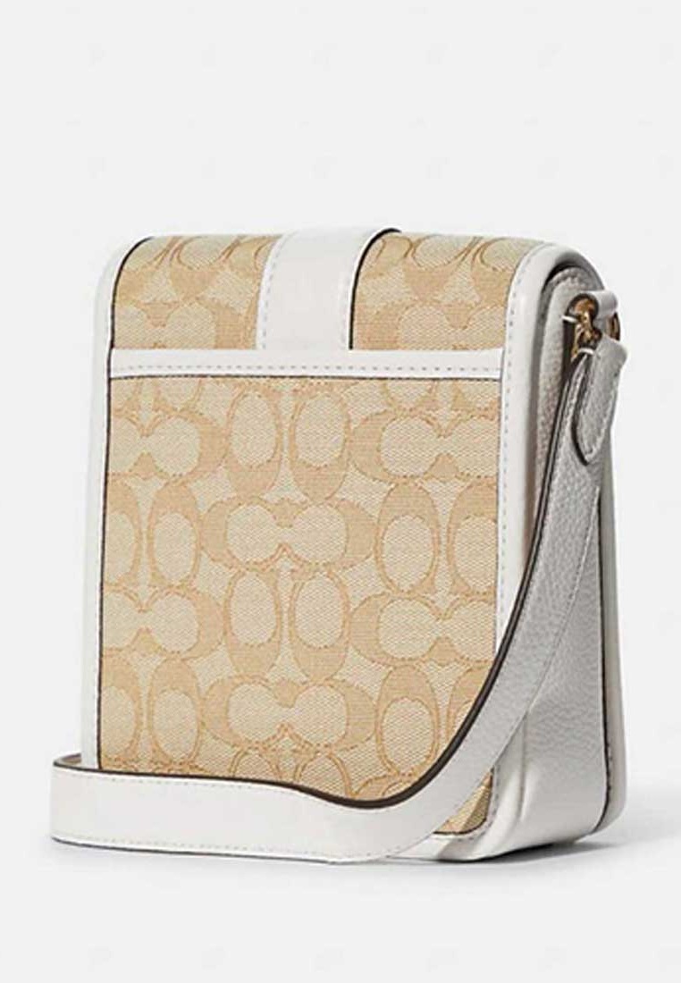 white sling bag coach